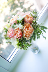 Beautiful bride's bouquet near the window