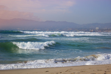 Big waves breaking against the rocks. Waves breaking over the ro