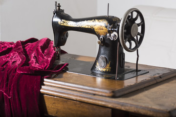 antique sewing machine in a study tailoring. Italian manufacturing