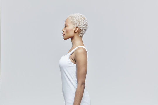 Profile of woman in front of grey background