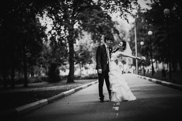 Black white photography beautiful young couple stand on background forest