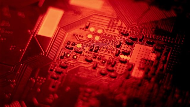 Circuit board close-up with changing red lighting