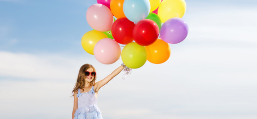 Fototapeta na wymiar happy girl with colorful balloons