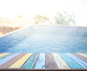Wood Table Top of Background and Pool