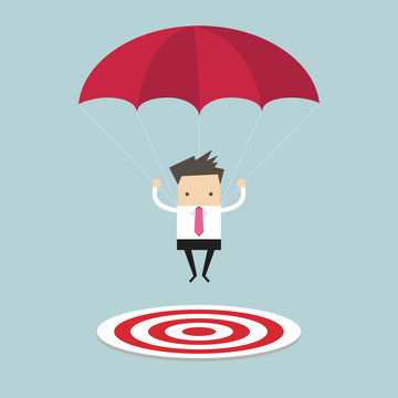 Businessman With Parachute Focused On A Target