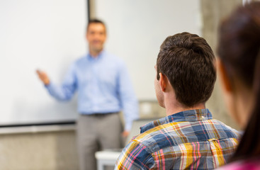 group of students and teacher in classroom