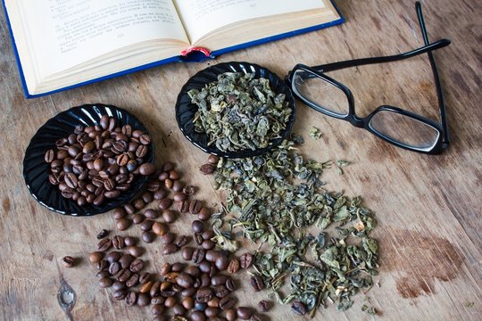 Open book glasses tea and coffee beans