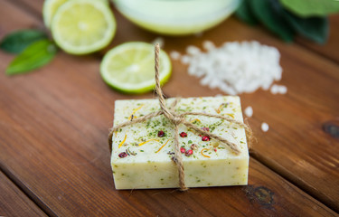 close up of handmade herbal soap bar on wood