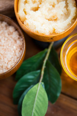 close up of body scrub in wooden bowl