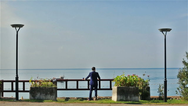 Stylish groom enjoying the view of Montenegro, Budva