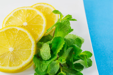 sliced lemon and fresh mint