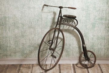 Historical bicycle by the wall