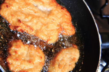 preparing czech chicken schnitzel..