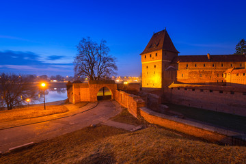 Fototapeta na wymiar The Castle of the Teutonic Order in Malbork at dusk, Poland