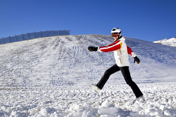 young woman is enjoying winter sport