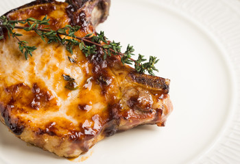 Grilled pork on the white plate