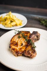 Grilled pork on the white plate