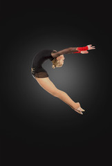 Professional gymnast  jumping in studio