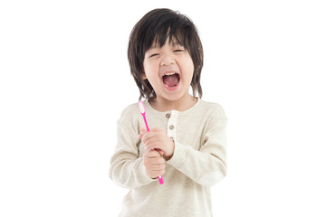 Cute asian boy brushing teeth on white background isolated