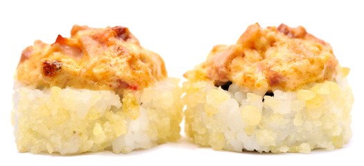 Pair of baked japanese rolls with cheese sauce isolated