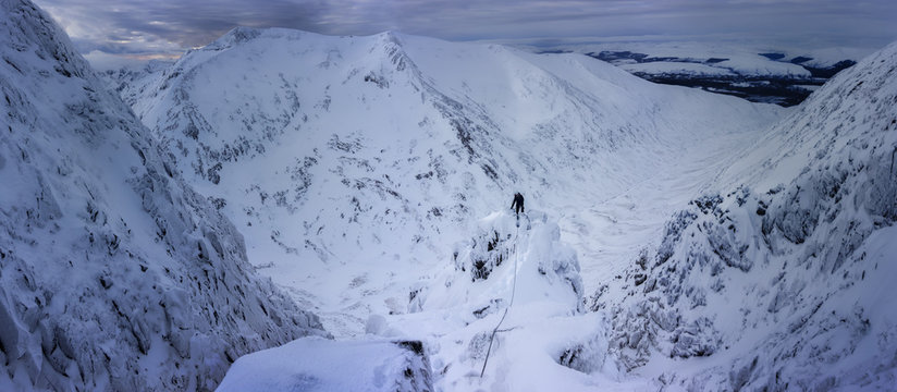 UK, Scotland, Glencoe, winter landscape at Aonach Mor with ice climber