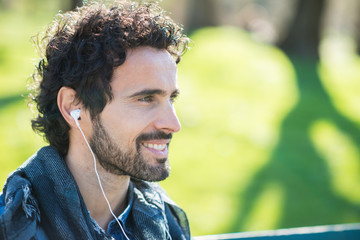 Man listening music outdoors