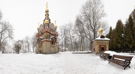 Bridge leading to the Peter and Paul Cathedral and chapel-tomb of Paskevich in city park in Gomel, Belarus. Winter