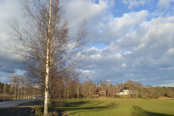 Obraz premium The mansion in the countryside in southern Finland . The sky is dark and stormy rising