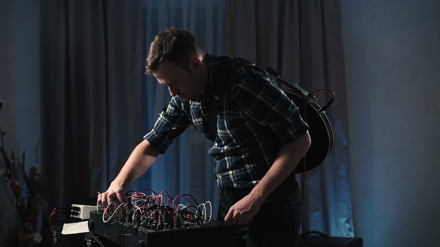 The musician's home studio experimenting with synthesizers. 