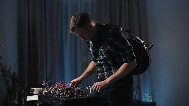 knobs on analog synthesizer music equipment