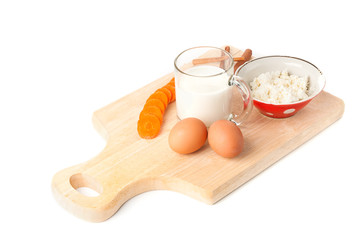 Healthy breakfast with cheese cottage, milk, eggs and carrot