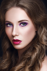Fototapeta premium Beautiful Model Woman with Long Curly Brown Hair and Makeup