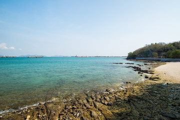 Sea rocky shore on the cloudless sky
