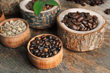 Collection of coffee beans on old wooden table, close up