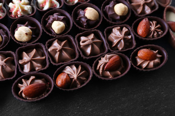 Chocolate sweets on wooden background