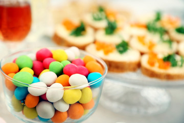 Set of cold snacks, canape, beverages and dessert, closeup