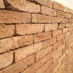 Perspective of a red brick wall