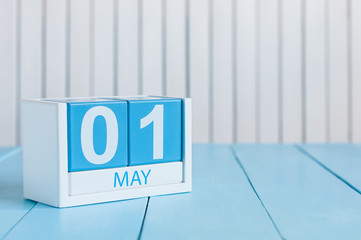 May 1st. Image of may 1 wooden color calendar on white background.  Spring day, empty space for text.  International Workers' Day
