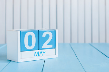 May 2nd. Image of may 2 wooden color calendar on white background.  Spring day, empty space for...