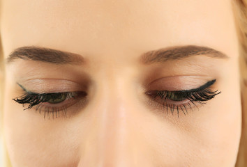 Female eyes with light make-up, closeup