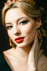 Beautiful blonde girl with a golden crown