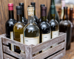Wine bottles in a wooden crate . © volff
