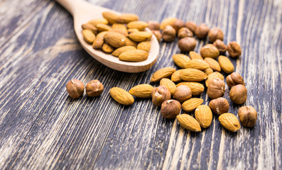 Almonds in wooden spoon 