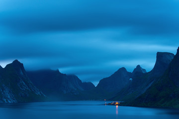 Great mountains of Lofoten islands, Norway in the night or early morning. Night view of Reine village. - 104406377
