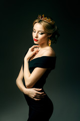 Beautiful blonde girl with a golden crown