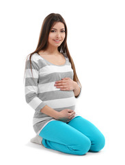 Beautiful pregnant woman isolated on white