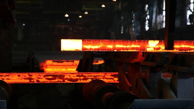 red hot slabs on stell plant conveyor