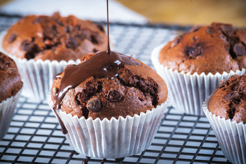 Muffins topped with warm chocolate