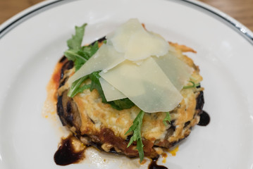 grilled eggplant and tomatoes sauce, layered with cheese