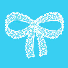 Decorative lacy bow on blue background